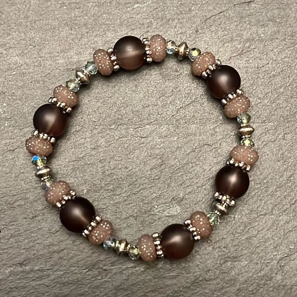 Handcrafted beaded bracelet with metal bead detail - Picture 1 of 2